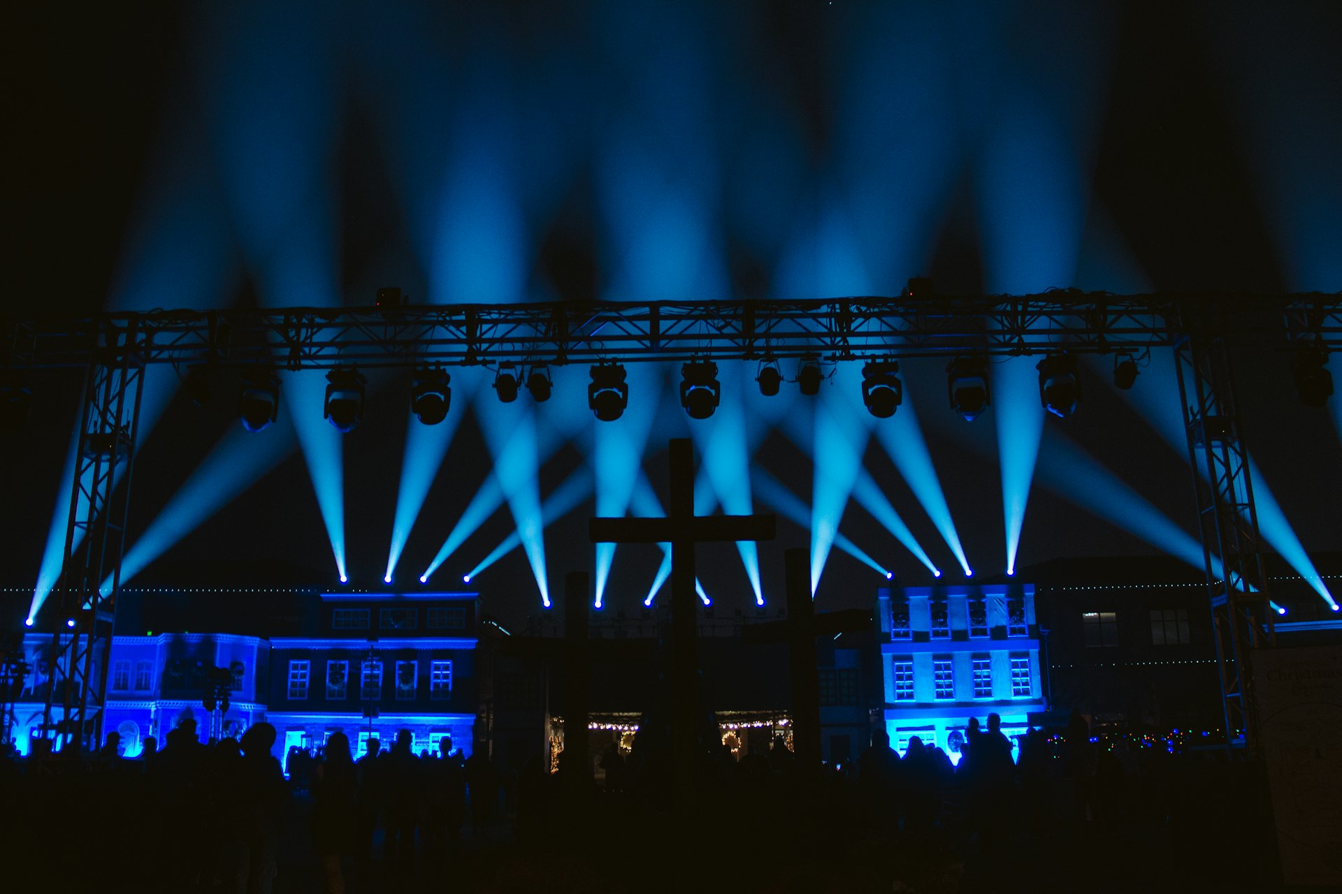 a stage lit up with blue lights at night